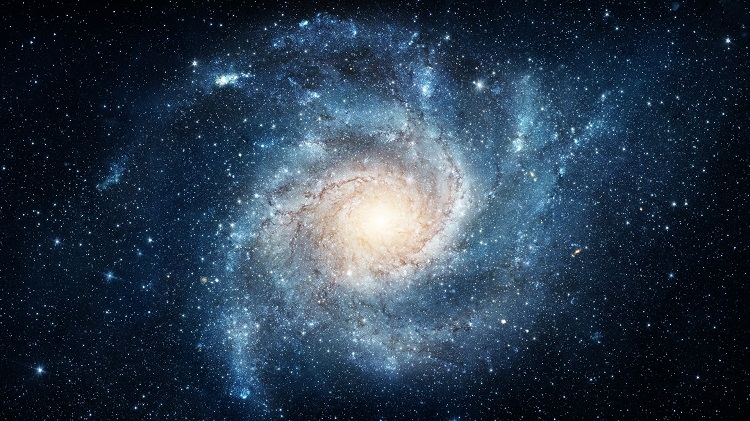 A Via Láctea é uma galáxia espiral, como a da imagem, de aproximadamente 100 mil anos-luz de diâmetro.